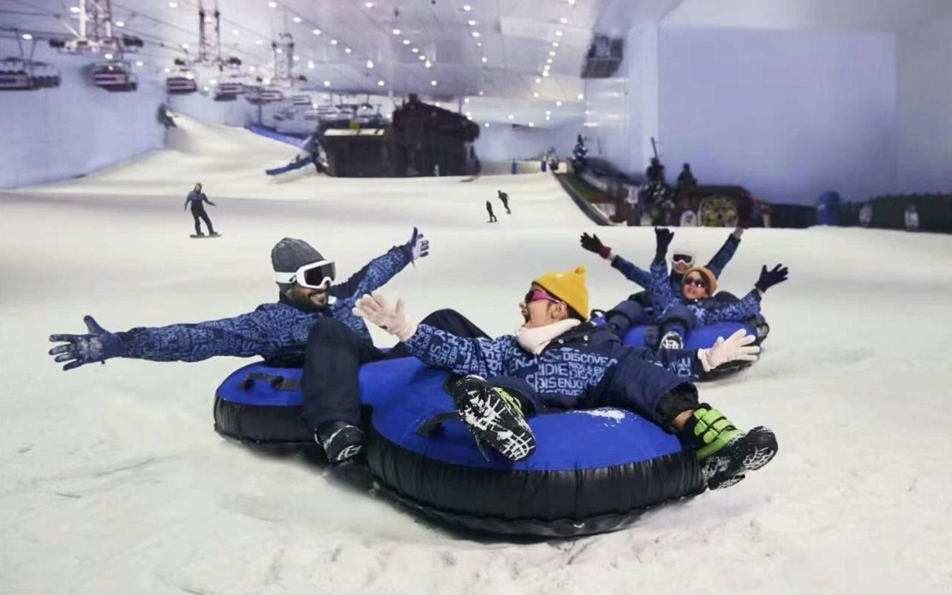 Visitors enjoying skiing and snow activities at Ski Dubai, an indoor ski resort featuring year-round winter experiences.