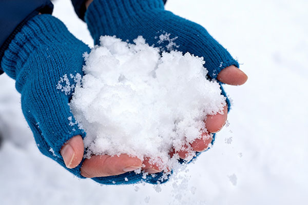 Artificial snow texture produced by a high-temperature snow making machine, creating high-quality snow for skiing, snow parks, and winter attractions.