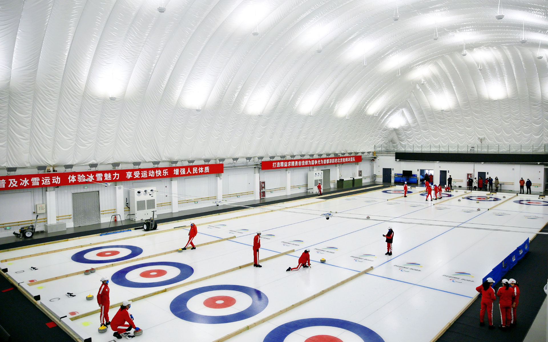 Air-dome curling rink featuring a professional ice surface, energy-efficient refrigeration system, and year-round curling facilities.