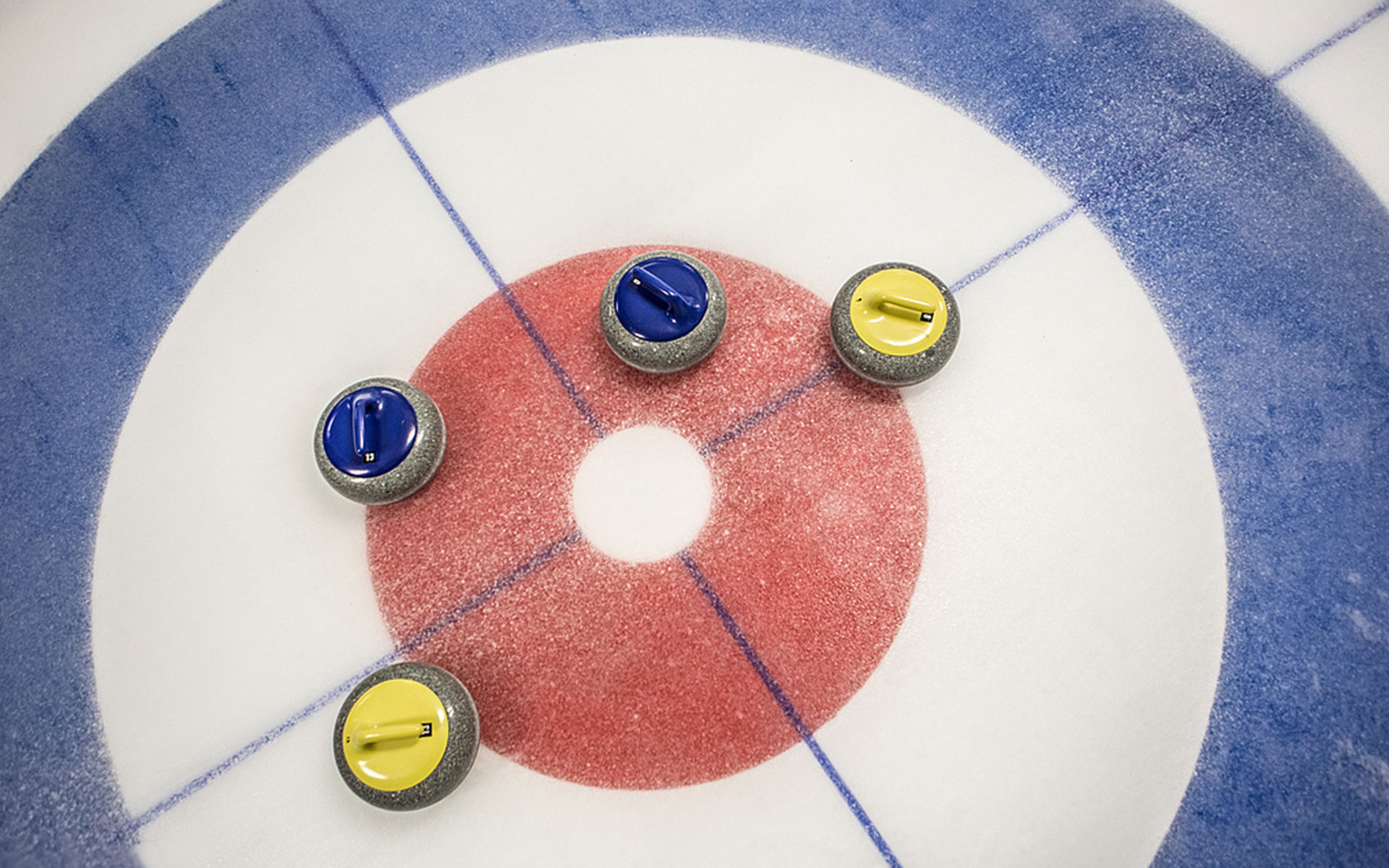 Pebbled ice surface on a curling rink providing optimal stone movement and professional competition performance.